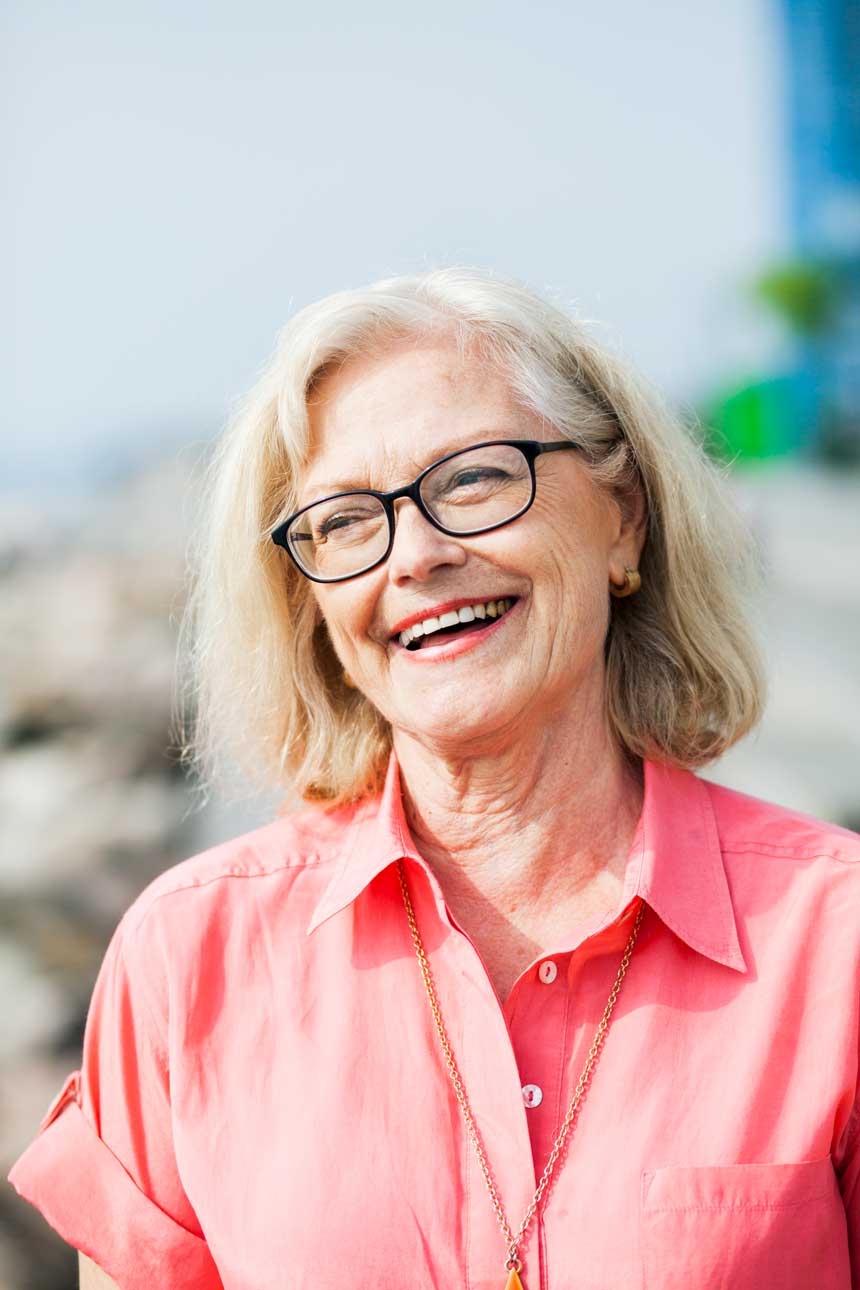 smiling-senior-woman-wearing-glasses-outdoors-2024-10-11-11-10-32-utc